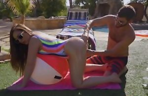 Delicious brunette fucks bearded guy by the pool