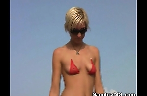 Hot blonde in small red bikini