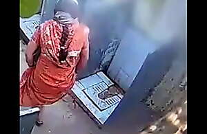 Desi bhabhi urinating there open toilet